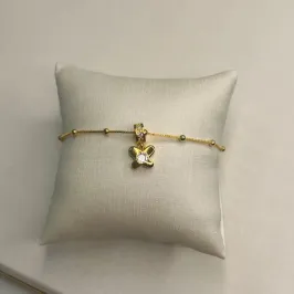 Pulseira bolinhas com berloque de flor