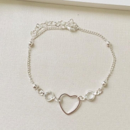 Pulseira com coração vazado e pontos de luz