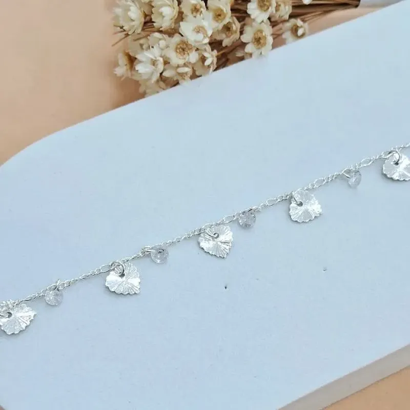 Pulseira folhas e pontos de luz
