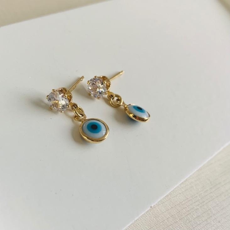 Brinco zirônia com olho grego
