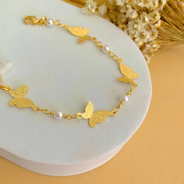 Pulseira borboletas e pérolas