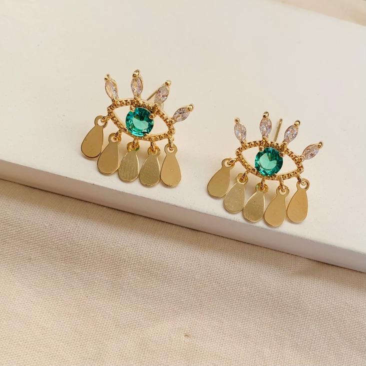 Brinco lux olho grego