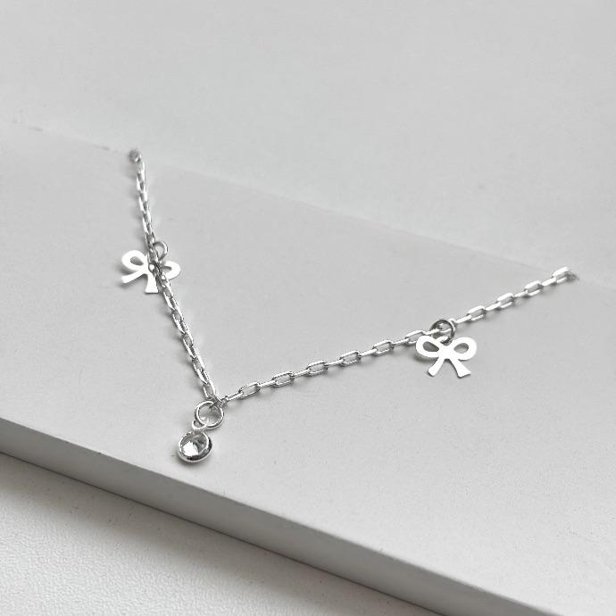 Tornozeleira laço e ponto de luz