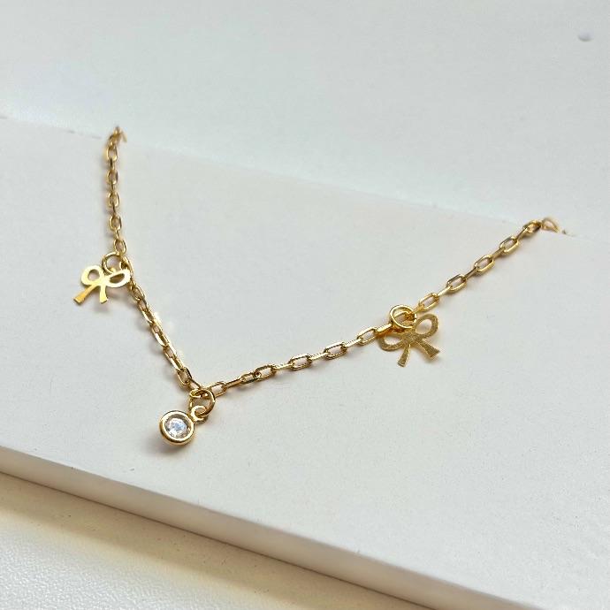 Tornozeleira laço e ponto de luz