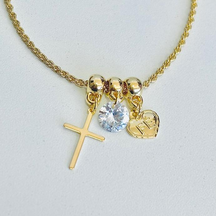 Pulseira berloque cruz, ponto de luz e coração